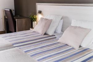 Posteľ alebo postele v izbe v ubytovaní Hotel Planas