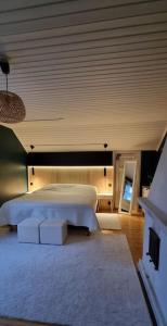 Säng eller sängar i ett rum på Huvila Kyrönniemi