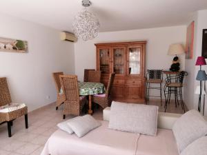 a living room with a couch and chairs and a table at Escapade Audoise in Sallèles-dʼAude