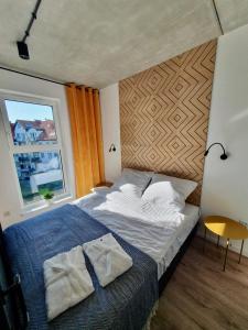 Postel nebo postele na pokoji v ubytování Green Port SPA Kołobrzeg STYLOWY LOFT- w cenie klimatyzacja, baseny, 2 jacuzzi, sauna, szlafroki, bawialnia + 18 fotografií