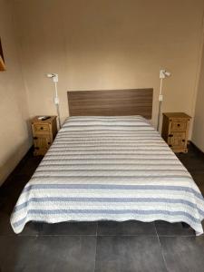 Ένα ή περισσότερα κρεβάτια σε δωμάτιο στο apart centro