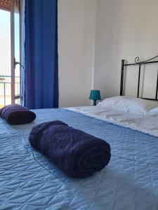 En eller flere senge i et værelse på Coralli Di Mare Apartments