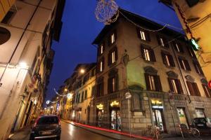 a building on a city street at night at Dimora Pieri in Florence
