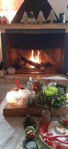 a fireplace with a bunch of food in front of it at B&B dell'Osteria in SantʼAnatolia di Narco