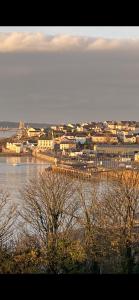 a view of a city with a body of water at Flat 3, Murray Crescent House in Milford Haven