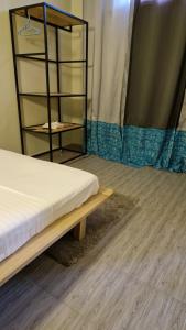 Ένα ή περισσότερα κρεβάτια σε δωμάτιο στο Résidences IBINLE