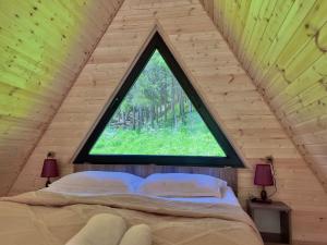Postel nebo postele na pokoji v ubytování Sno Woodland