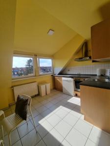 a kitchen with a table and a chair in it at Süße Marie 2 in Karlsruhe