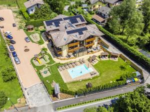 an aerial view of a house with a swimming pool at Residence Toli in Ledro