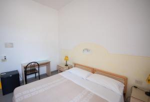 Postel nebo postele na pokoji v ubytování Hotel Villa Cecilia
