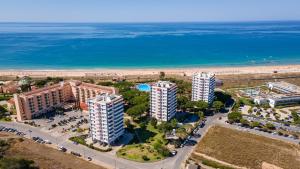 an aerial view of buildings and the beach at Casa Meri in Alvor