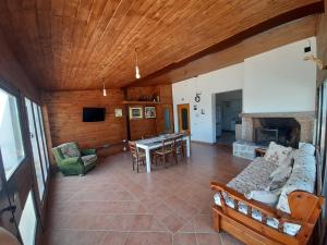 a living room with a couch and a fireplace at casa Mary Corbara in Corbara