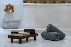 a pile of towels sitting on the floor in a bathroom at Mirada Exclusive Bodrum in Bodrum City