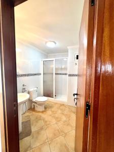 a bathroom with a toilet and a sink at Relax Island in Oued Laou