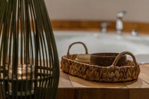 a basket sitting on a counter next to a bath tub at Mirada Exclusive Bodrum in Bodrum City