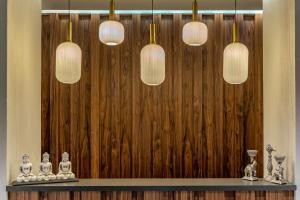 a room with three lights and a wooden wall at Mirada Exclusive Bodrum in Bodrum City
