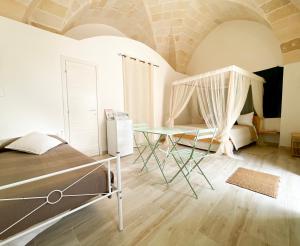 Postel nebo postele na pokoji v ubytování B&B Borgo Monacizzo