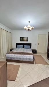 מיטה או מיטות בחדר ב-cairo apatment