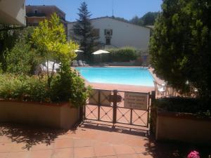 Bazén v ubytovaní Porto Azzuro Apartment 6 Beds alebo v jeho blízkosti