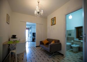 a living room with a couch and a table at Al Centro in Gangi