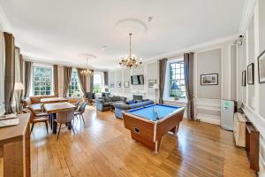 a living room with a pool table in it at Finest Retreats - Roulston Hall Apt in Thirsk