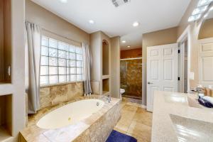a large bathroom with a tub and a window at Desert Haven Hideaway in Phoenix +14 photos