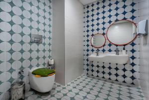 a bathroom with a toilet and a sink and a mirror at Mirada Exclusive Bodrum in Bodrum City