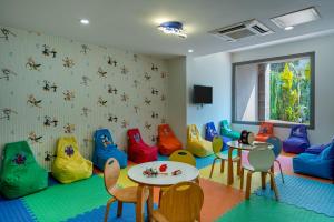 a waiting room with tables and colorful chairs at Mirada Exclusive Bodrum in Bodrum City