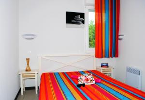 En eller flere senge i et værelse på Résidence Goélia Les Terrasses de l'Océan + 26 billeder