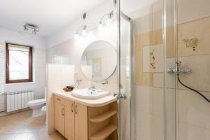 a bathroom with a sink and a shower at Willa Marta Zakopane in Zakopane