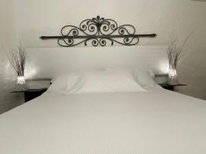 En eller flere senge i et værelse på Sa Maluni