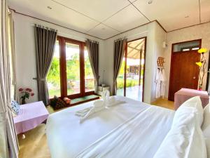 Voodi või voodid majutusasutuse BaanSuk Sukhothai Resort toas