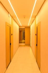 a corridor of an office building with doors and a hallway at Vertigo Hotel in Lagos