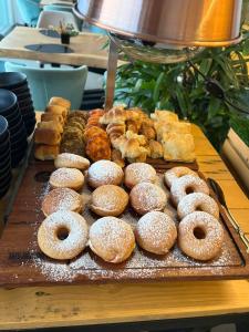 a bunch of donuts and other pastries on a table at Vertigo Hotel in Lagos