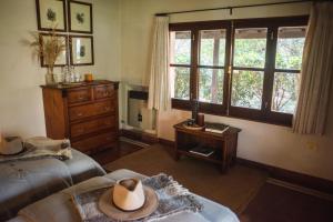 a bedroom with two beds and a hat on the bed at Rincón del Socorro in Uguay
