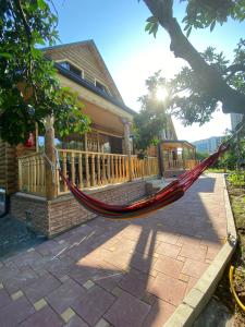 a hammock in front of a house at Guest House on Angisa in Batumi