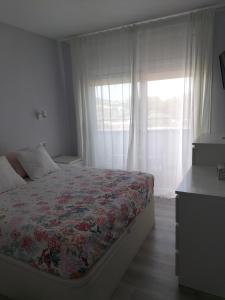 מיטה או מיטות בחדר ב-Vilar d'Aro Apartment
