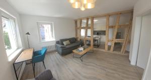 TV a/nebo společenská místnost v ubytování City-Apartments direkt am See - SEEBLICK!