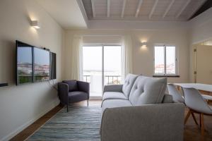 TV a/nebo společenská místnost v ubytování Casa da Rocha - Totalmente Renovada