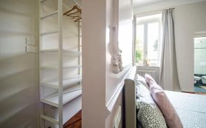 a bedroom with a book shelf next to a bed at Bramante 21 in Pesaro