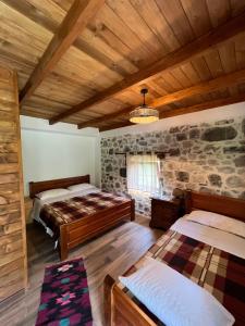 Postel nebo postele na pokoji v ubytování Molla Guest House