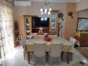 a dining room with a table and chairs at Christina's Home in Sarti