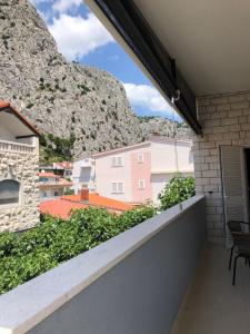 a balcony with a view of the mountains at Omis - private Ensuite room with balcony - hotel style in Omiš