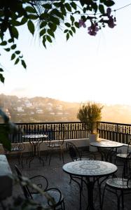 a group of tables and chairs on a patio at Moon Valley Villas Đà Lạt in Xuan An