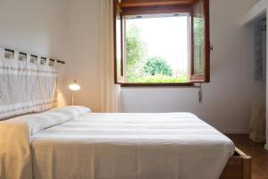 Postel nebo postele na pokoji v ubytování Villa Ines