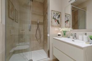 a bathroom with a shower and a sink and a toilet at CASA UCCELLINI with a Romantic Terrace in Lucca +64 photos