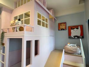 Postel nebo postele na pokoji v ubytování Flying Orange Homestay