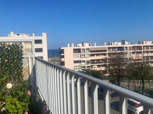 a balcony of a building with buildings in the background at Vannina in Bastia