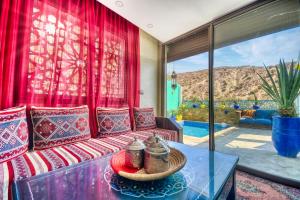 a living room with a couch and a table at Route de miel in Agadir