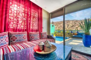 a living room with a couch and a table at Route de Miel in Agadir